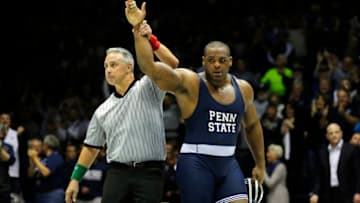 STATE COLLEGE, PA -DECEMBER 19: 285 pounder Jimmy Lawson of the Penn State Nittany Lions gets his hand raised by the referee after winning his match in overtime on December 19, 2014 at Recreation Hall on the campus of Penn State University in State College, Pennsylvania. Penn State won 20-15. (Photo by Hunter Martin/Getty Images)
