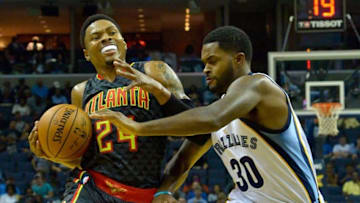 Oct 6, 2016; Memphis, TN, USA; Atlanta Hawks guard Kent Bazemore (24) dribbles the ball as Memphis Grizzlies guard Troy Daniels (30) defends during the first half at FedExForum. Mandatory Credit: Jim Brown-USA TODAY Sports
