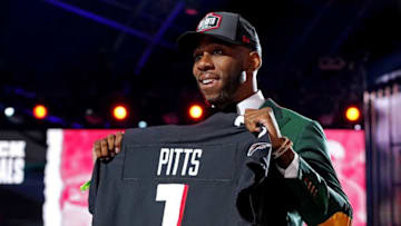 Apr 29, 2021; Cleveland, Ohio, USA; Kyle Pitts (Florida) poses with a jersey after being selected by Atlanta Falcons as the number four overall pick in the first round of the 2021 NFL Draft at First Energy Stadium. Mandatory Credit: Kirby Lee-USA TODAY Sports