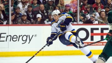 Apr 20, 2015; Saint Paul, MN, USA; St. Louis Blues forward T.J. Oshie (74) shoots during the first period in game three of the first round of the 2015 Stanley Cup Playoffs against the Minnesota Wild at Xcel Energy Center. Mandatory Credit: Brace Hemmelgarn-USA TODAY Sports
