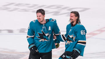 SAN JOSE, CA - APRIL 23: San Jose Sharks center Logan Couture (39) and San Jose Sharks defenseman Erik Karlsson (65) enjoying the moment after winning Game 7, Round 1 between the Vegas Golden Knights and the San Jose Sharks on Tuesday, April 23, 2019 at the SAP Center in San Jose, California. (Photo by Douglas Stringer/Icon Sportswire via Getty Images)