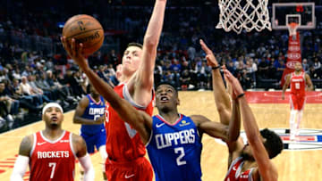 LOS ANGELES, CA - OCTOBER 21: Shai Gilgeous-Alexander #2 of the Los Angeles Clippers goes for a layup against Isaiah Hartenstein #55 and Michael Carter-Williams #1 of the Houston Rockets during the second half of a basketball game at Staples Center on October 21, 2018 in Los Angeles, California. NOTE TO USER: User expressly acknowledges and agrees that, by downloading and or using this photograph, User is consenting to the terms and conditions of the Getty Images License Agreement. (Photo by Kevork Djansezian/Getty Images)