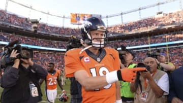 Oct 5, 2014; Denver, CO, USA; Denver Broncos quarterback Peyton Manning (18) following the win over the Arizona Cardinals at Sports Authority Field at Mile High. The Broncos defeated the Cardinals 41-20. Mandatory Credit: Ron Chenoy-USA TODAY Sports