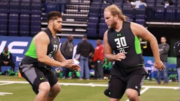 Feb 26, 2016; Indianapolis, IN, USA; Oregon State offensive lineman Isaac Seumalo (37) and Wisconsin Badgers offensive lineman Tyler Marz participate in workout drills during the 2016 NFL Scouting Combine at Lucas Oil Stadium. Mandatory Credit: Brian Spurlock-USA TODAY Sports