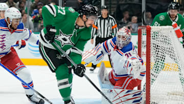 DALLAS, TEXAS - NOVEMBER 20: Igor Shesterkin #31 of the New York Rangers watches as Mason Marchment #27 of the Dallas Stars plays the puck in front of the net during the first period at American Airlines Center on November 20, 2023 in Dallas, Texas. (Photo by Sam Hodde/Getty Images)