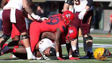 TUCSON, AZ - NOVEMBER 24: Offensive lineman Steven Miller #71 of the Arizona State Sun Devils looses his helmet while recovering a fumble during the first half of the college football game against the Arizona Wildcats at Arizona Stadium on November 24, 2018 in Tucson, Arizona. (Photo by Ralph Freso/Getty Images)