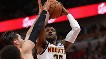 CHICAGO, IL - OCTOBER 31: Malik Beasley #25 of the Denver Nuggets shoots against Ryan Arcidiacono #51 of the Chicago Bulls at the United Center on October 31, 2018 in Chicago, Illinois. The Nuggets defeated the Bulls 108-107 in overtime. NOTE TO USER: User expressly acknowledges and agrees that, by downloading and/or using this photograph, User is consenting to the terms and conditions of the Getty Images License Agreement. (Photo by Jonathan Daniel/Getty Images)