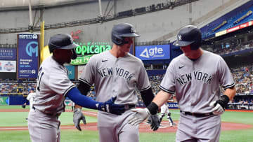 ST PETERSBURG, FLORIDA - MAY 28: Miguel Andújar #41 celebrates with DJ LeMahieu #26 and Anthony Rizzo #48 after LeMahieu scored in the first inning against the Tampa Bay Rays at Tropicana Field on May 28, 2022 in St Petersburg, Florida. (Photo by Julio Aguilar/Getty Images)