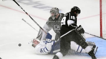 LOS ANGELES, CALIFORNIA - MARCH 05: Auston Matthews #34 of the Toronto Maple Leafs collides with Jonathan Quick #32 and Alex Iafallo #19 of the Los Angeles Kings during the third period in a 1-0 Kings overtime shootout win at Staples Center on March 05, 2020 in Los Angeles, California. (Photo by Harry How/Getty Images)