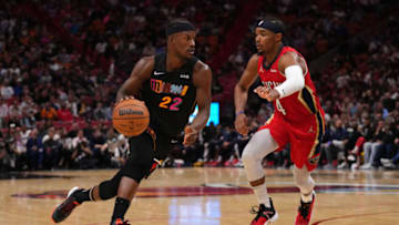 Miami Heat forward Jimmy Butler (22) drives the ball around New Orleans Pelicans guard Devonte' Graham (4)(Jasen Vinlove-USA TODAY Sports)