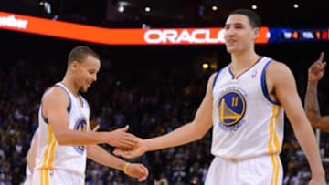 December 3, 2013; Oakland, CA, USA; Golden State Warriors point guard Stephen Curry (30, left) and shooting guard Klay Thompson (11) celebrate during the fourth quarter against the Toronto Raptors at Oracle Arena. The Warriors defeated the Raptors 112-103. Mandatory Credit: Kyle Terada-USA TODAY Sports