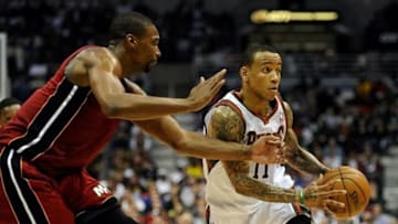 Apr 28, 2013; Milwaukee, WI, USA; Milwaukee Bucks guard Monta Ellis (right) drives for the basket against Miami Heat center Chris Bosh (eft) in game four of the first round of the 2013 NBA playoffs at the BMO Harris Bradley Center. Mandatory Credit: Benny Sieu-USA TODAY Sports