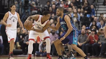 Jan 1, 2016; Toronto, Ontario, CAN; Toronto Raptors guard DeMar DeRozan (10) controls the ball as Charlotte Hornets guard Nicolas Batum (5) tries to defend during the second quarter in a game at Air Canada Centre. Mandatory Credit: Nick Turchiaro-USA TODAY Sports