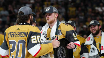 Jun 13, 2023; Las Vegas, Nevada, USA; Vegas Golden Knights forward Chandler Stephenson (20) hands over Stanley Cup to forward Jack Eichel (9) after defeating the Florida Panthers in game five of the 2023 Stanley Cup Final at T-Mobile Arena. Mandatory Credit: Stephen R. Sylvanie-USA TODAY Sports