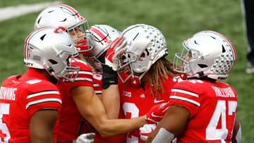 Nov 21, 2020; Columbus, Ohio, USA; Ohio State Buckeyes cornerback Shaun Wade (24) celebrates his touchdown return on the interception with linebacker Baron Browning (5) and linebacker Justin Hilliard (47) during the third quarter against the Indiana Hoosiers at Ohio Stadium. Mandatory Credit: Joseph Maiorana-USA TODAY Sports