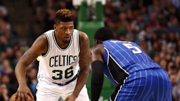 Jan 29, 2016; Boston, MA, USA; Boston Celtics guard Marcus Smart (36) dribbles the ball as Orlando Magic guard Victor Oladipo (5) defends during the second half at TD Garden. Mandatory Credit: Mark L. Baer-USA TODAY Sports