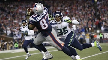 Nov 13, 2016; Foxborough, MA, USA; New England Patriots tight end Rob Gronkowski (87) pulls in a pass while defended by Seattle Seahawks cornerback DeShawn Shead (35) during the fourth quarter at Gillette Stadium. The Seattle Seahawks won 31-24. Mandatory Credit: Greg M. Cooper-USA TODAY Sports