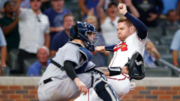 ATLANTA, GA - AUGUST 24: Freddie Freeman #5 of the Atlanta Braves is called out at the plate on the tag by Gary Sanchez #24 of the New York Yankees in the fifth inning at Truist Park on August 24, 2021 in Atlanta, Georgia. (Photo by Todd Kirkland/Getty Images)