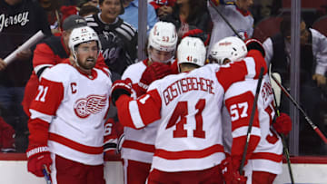 Oct 12, 2023; Newark, New Jersey, USA; The Detroit Red Wings celebrate a goal by Detroit Red Wings right wing Alex DeBrincat (93) against the New Jersey Devils during the third period at Prudential Center. Mandatory Credit: Ed Mulholland-USA TODAY Sports