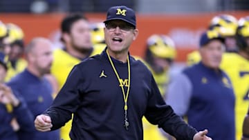 ARLINGTON, TX - SEPTEMBER 02: Head coach Jim Harbaugh of the Michigan Wolverines looks on during warmups before the college football game against the Florida Gators at AT&T Stadium on September 2, 2017 in Arlington, Texas. (Photo by Ronald Martinez/Getty Images)
