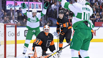 TORONTO, ON - MARCH 15: Toronto Maple Leafs Left Wing Zach Hyman (11) and Center John Tavares (91) celebrate a goal on Philadelphia Flyers Goalie Brian Elliott (37) during the regular season NHL game between the Philadelphia Flyers and Toronto Maple Leafs on March 15, 2019 at Scotiabank Arena in Toronto, ON. (Photo by Gerry Angus/Icon Sportswire via Getty Images)