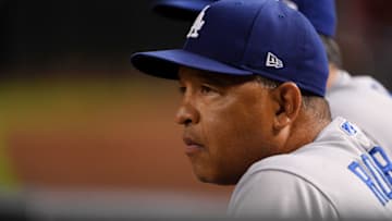 PHOENIX, ARIZONA - AUGUST 30: Manager Dave Roberts #30 of the Los Angeles Dodgers looks on from the top step of the dugout during the eighth inning of a game against the Arizona Diamondbacks at Chase Field on August 30, 2019 in Phoenix, Arizona. Diamondbacks won 5-4. (Photo by Norm Hall/Getty Images)