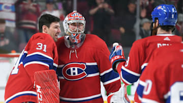 MONTREAL, QC - APRIL 6: Charlie Lindgren #39 and Carey Price #31 of the Montreal Canadiens celebrate after defeating the Toronto Maple Leafs in the NHL game at the Bell Centre on April 6, 2019 in Montreal, Quebec, Canada. (Photo by Francois Lacasse/NHLI via Getty Images)