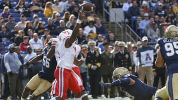 ANNAPOLIS, MD - OCTOBER 20: Houston Cougars quarterback D'Eriq King (4) throws a pass under pressure from Navy Midshipmen defensive tackle Jackson Pittman (99) on October 20, 2018, at Navy - Marine Corps Memorial Stadium in Annapolis, MD. The Houston Cougars defeated the Navy Midshipmen, 49-36. (Photo by Mark Goldman/Icon Sportswire via Getty Images)