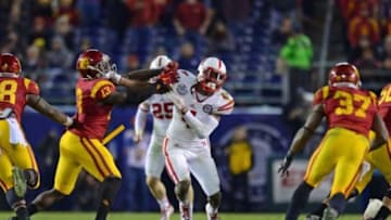 Dec 27, 2014; San Diego, CA, USA; Nebraska Cornhuskers defensive end Randy Gregory (4) works against USC Trojans tight end Bryce Dixon (13) during the fourth quarter in the 2014 Holiday Bowl at Qualcomm Stadium. Mandatory Credit: Jake Roth-USA TODAY Sports