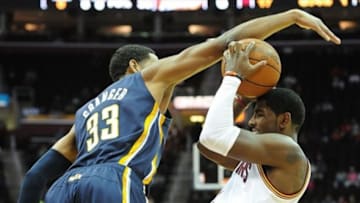 October 23, 2012; Cleveland, OH USA: Cleveland Cavaliers point guard Kyrie Irving (2) goes up for a shot as Indiana Pacers small forward Danny Granger (33) defends during a preseason game at Quicken Loans Arena. Mandatory Credit: Eric P. Mull-USPRESSWIRE