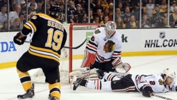 Jun 24, 2013; Boston, MA, USA; Boston Bruins center Tyler Seguin (19) takes a shot against Chicago Blackhawks defenseman Duncan Keith (2) and goalie Corey Crawford (50) during the first period in game six of the 2013 Stanley Cup Final at TD Garden. Mandatory Credit: Michael Ivins-USA TODAY Sports