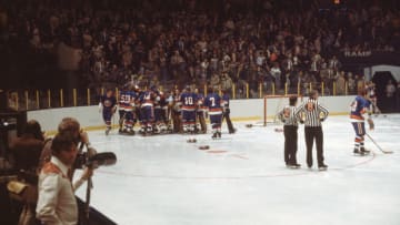 J.P. Parise of the New York Islanders is mobbed by his teammates after his overtime goal helped them beat their rivals the New York Rangers at Madison Square Garden, New York, New York, April 11, 1975. (Photo by Melchior