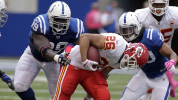 INDIANAPOLIS, IN - OCTOBER 9: Jackie Battle #26 of the Kansas City Chiefs breaks free from Philip Wheeler #50 of the Indianapolis Colts and Antonio Johnson #99 of the Indianapolis Colts during the second half of play at Lucas Oil Field on October 9, 2011 in Indianapolis, Indiana. The Chiefs won 28-24. (Photo by John Sommers II/Getty Images)