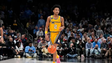 Dec 21, 2022; Charlotte, North Carolina, USA; Michigan Wolverines guard Kobe Bufkin (2) brings the ball up court during the second half against the North Carolina Tar Heels at the Jumpman Classic at the Spectrum Center. Mandatory Credit: Jim Dedmon-USA TODAY Sports