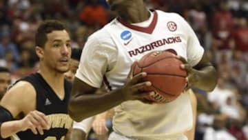 Mar 19, 2015; Jacksonville, FL, USA; Wofford Terriers forward Lee Skinner (34) defends as Arkansas Razorbacks forward Bobby Portis (10) moves to the basket in the first half of a game in the second round of the 2015 NCAA Tournament at Jacksonville Veteran Memorial Arena. Mandatory Credit: John David Mercer-USA TODAY Sports