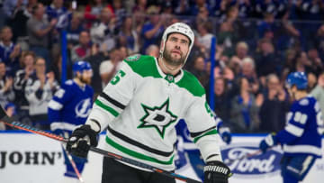 TAMPA, FL - FEBRUARY 14: The Tampa Bay Lightning celebrate a goal against a dejected Roman Polak #45 of the Dallas Stars in the first period at Amalie Arena on February 14, 2019 in Tampa, Florida. (Photo by Scott Audette/NHLI via Getty Images)