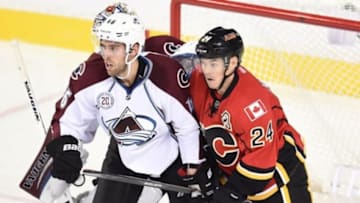 Sep 29, 2015; Calgary, Alberta, CAN; Calgary Flames center Jiri Hudler (24) tries to get position on Colorado Avalanche defenseman Brandon Gormley (46) during the second period at Scotiabank Saddledome. Flames won 2-0. Mandatory Credit: Candice Ward-USA TODAY Sports