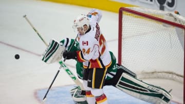 Mar 30, 2015; Dallas, TX, USA; Calgary Flames left wing Jiri Hudler (24) tries to redirect the puck past Dallas Stars goalie Kari Lehtonen (32) during the first period at the American Airlines Center. Mandatory Credit: Jerome Miron-USA TODAY Sports