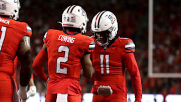 Sep 30, 2023; Tucson, Arizona, USA;Arizona Wildcats quarterback Noah Fifita (11) and wide receiver Jacob Cowing (2) celebrate after a touchdown throw in the first half at Arizona Stadium. Mandatory Credit: Zachary BonDurant-USA TODAY Sports