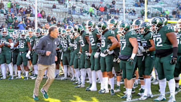 Nov 28, 2015; East Lansing, MI, USA; Michigan State Spartans head coach Mark Dantonio leads the team onto the field prior to a game against the Penn State Nittany Lions at Spartan Stadium. Mandatory Credit: Mike Carter-USA TODAY Sports