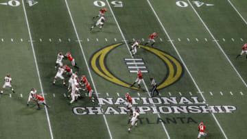 ATLANTA, GA - JANUARY 08: Quarterback Tua Tagovailoa #13 of the Alabama Crimson Tide (far left) drops back to pass during the College Football Playoff National Championship game against the Georgia Bulldogs at Mercedes-Benz Stadium on January 8, 2018 in Atlanta, Georgia. (Photo by Mike Zarrilli/Getty Images)
