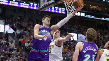 Auburn basketballOct 19, 2022; Salt Lake City, Utah, USA; Utah Jazz center Walker Kessler (24) gets past Denver Nuggets center Nikola Jokic (15) and to the basket during the second half at Vivint Arena. Mandatory Credit: Chris Nicoll-USA TODAY Sports