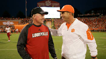 CLEMSON, SC - OCTOBER 01: Head coach Bobby Petrino of the Louisville Cardinals, left, meets with head coach Dabo Swinney of the Clemson Tigers prior to their game at Memorial Stadium on October 1, 2016 in Clemson, South Carolina. (Photo by Tyler Smith/Getty Images)