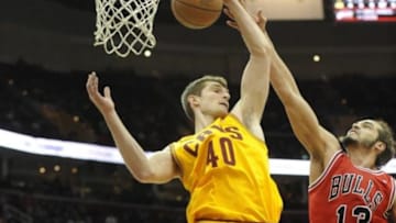 Jan 22, 2014; Cleveland, OH, USA; Cleveland Cavaliers center Tyler Zeller (40) grabs a rebound over Chicago Bulls center Joakim Noah in the fourth quarter at Quicken Loans Arena. Mandatory Credit: David Richard-USA TODAY Sports