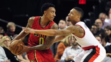 Jan 20, 2016; Portland, OR, USA; Atlanta Hawks guard Jeff Teague (0) looks to make a move on Portland Trail Blazers guard Damian Lillard (0) during the first quarter of the game at Moda Center at the Rose Quarter. Mandatory Credit: Steve Dykes-USA TODAY Sports