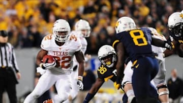 Nov 9, 2013; Morgantown, WV, USA; Texas Longhorns running back Johnathan Gray (32) runs with the ball in the first quarter against the West Virginia Mountaineers at Milan Puskar Stadium. Mandatory Credit: Evan Habeeb-USA TODAY Sports