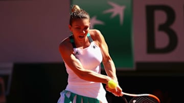 PARIS, FRANCE - JUNE 10: Simona Halep of Romania plays a backhand during the ladies singles final match against Jelena Ostapenko of Latvia Open at Roland Garros on June 10, 2017 in Paris, France. (Photo by Clive Brunskill/Getty Images)