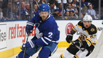 TORONTO, ON - APRIL 23: Brad Marchand #63 of the Boston Bruins skates to check Ron Hainsey #2 of the Toronto Maple Leafs in Game Six of the Eastern Conference First Round in the 2018 Stanley Cup Play-offs at the Air Canada Centre on April 23, 2018 in Toronto, Ontario, Canada. The Maple Leafs defeated the Bruins 3-1.(Photo by Claus Andersen/Getty Images) *** Local Caption *** Brad Marchand; Ron Hainsey