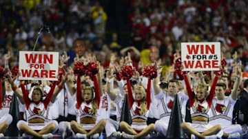 Apr 8, 2013; Atlanta, GA, USA; Louisville Cardinals cheerleaders hold up signs for injured player Kevin Ware (not pictured) during a free throw against the Michigan Wolverines during the second half of the championship game in the 2013 NCAA mens Final Four at the Georgia Dome. Mandatory Credit: Bob Donnan-USA TODAY Sports