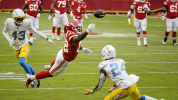 Jan 3, 2021; Kansas City, Missouri, USA; Kansas City Chiefs tight end Deon Yelder (82) reaches for but cannot catch a pass against Los Angeles Chargers cornerback Michael Davis (43) and free safety Nasir Adderley (24) during the first half at Arrowhead Stadium. Mandatory Credit: Jay Biggerstaff-USA TODAY Sports